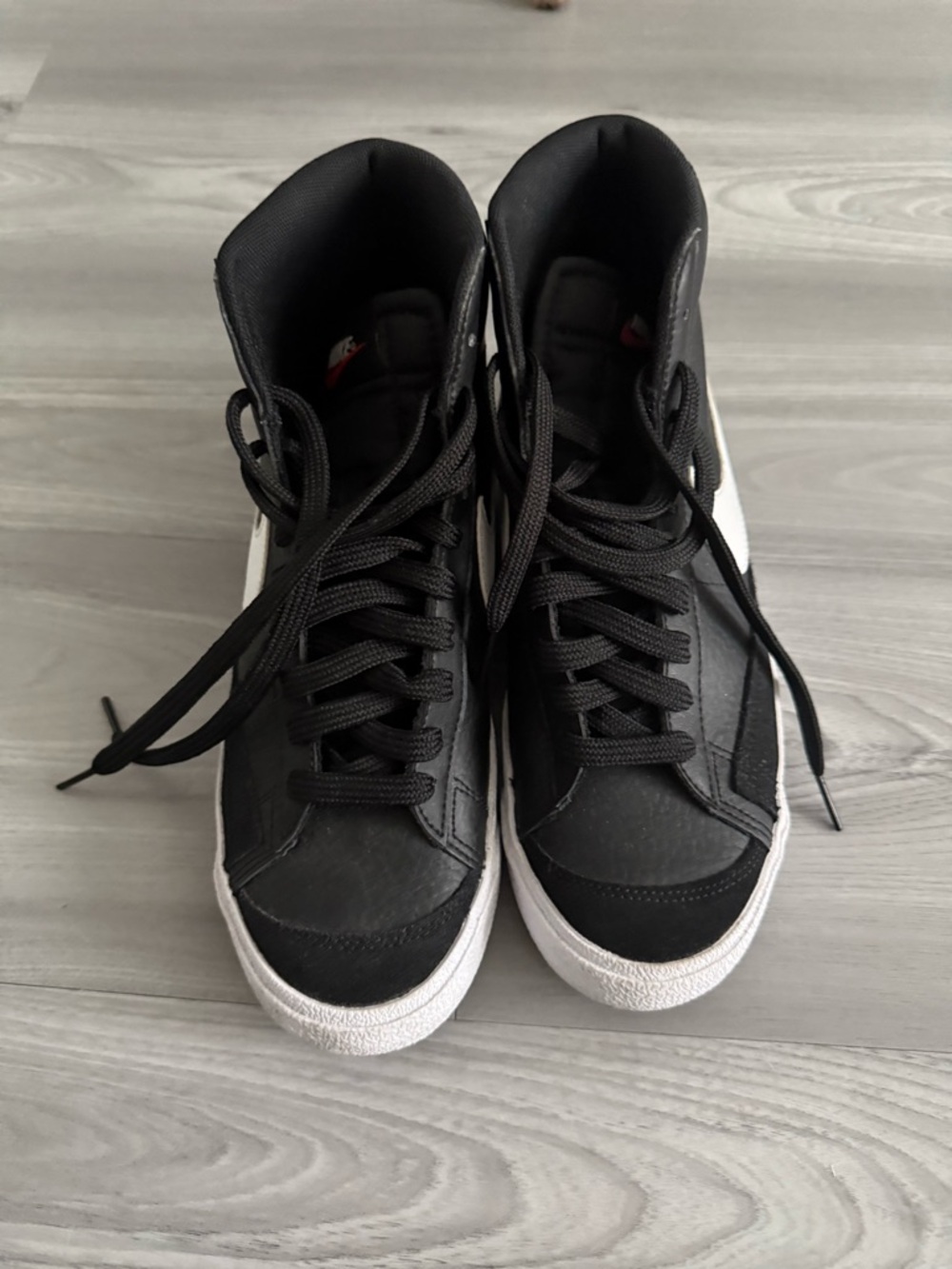 Nike Black High-Top Sneakers with White Tag Detail